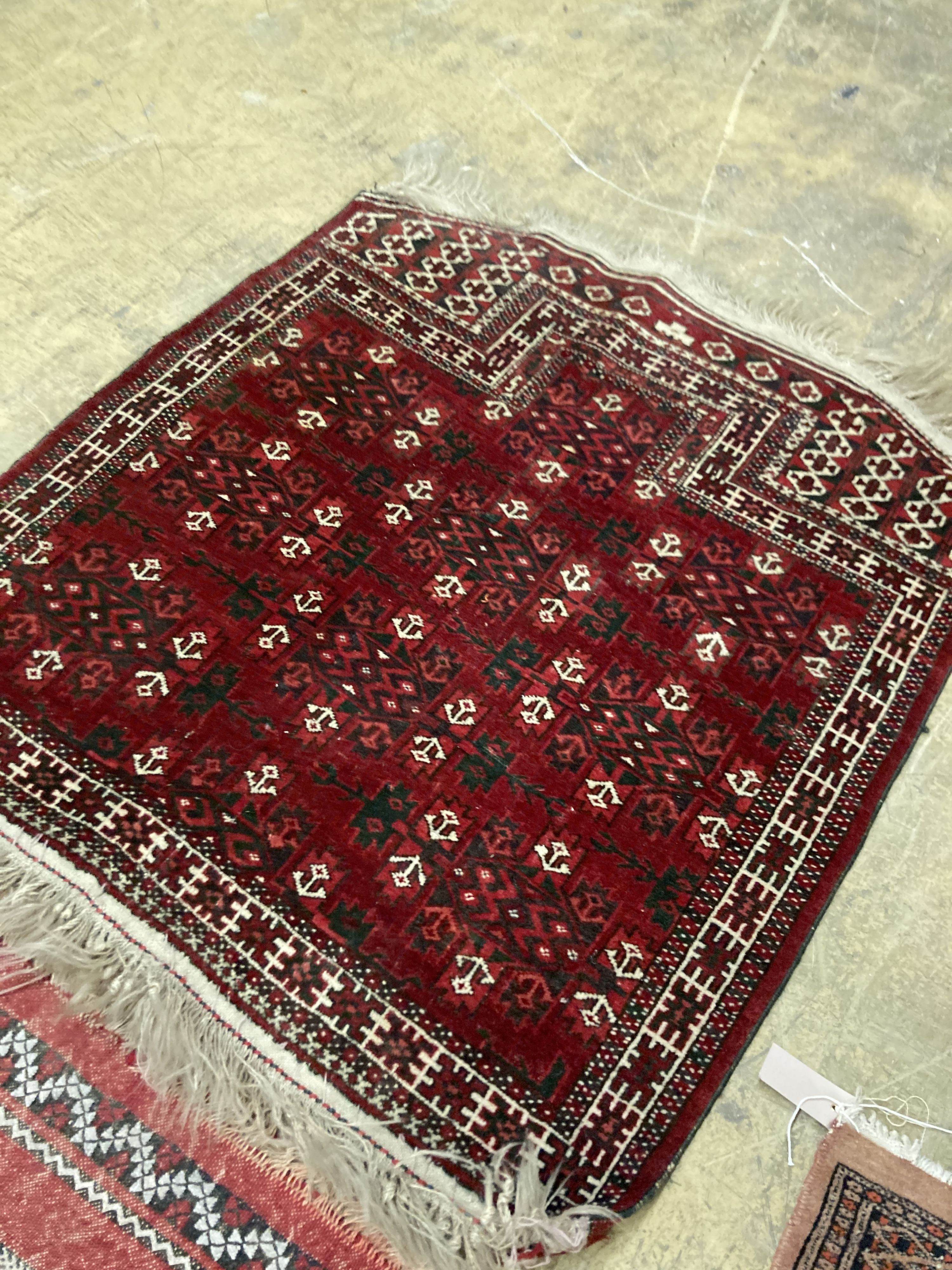 A Bokhara orange ground rug 198 x 125 cms, a smaller Anatolian flat weave rug and Bokhara prayer mat.